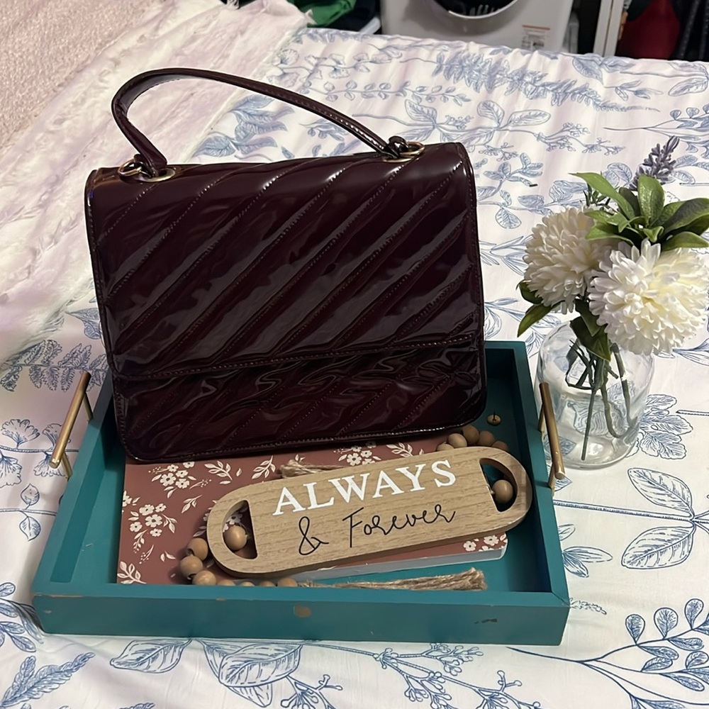 Brand new without tags, maroon, patent leather handbag gold hatdware